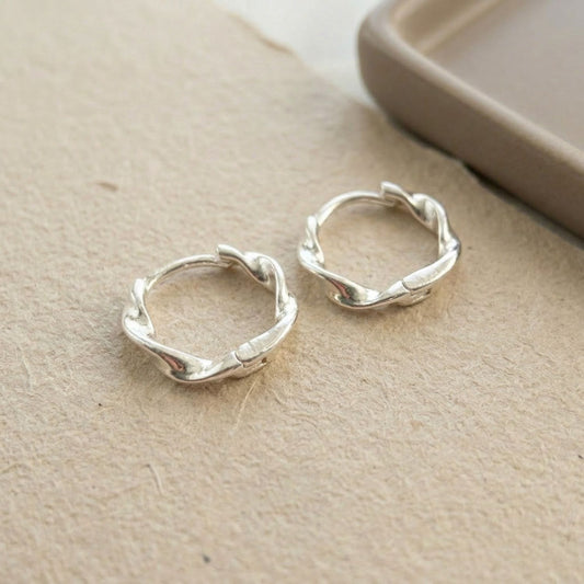 Twisted huggie hoop earrings — sterling silver, 16mm