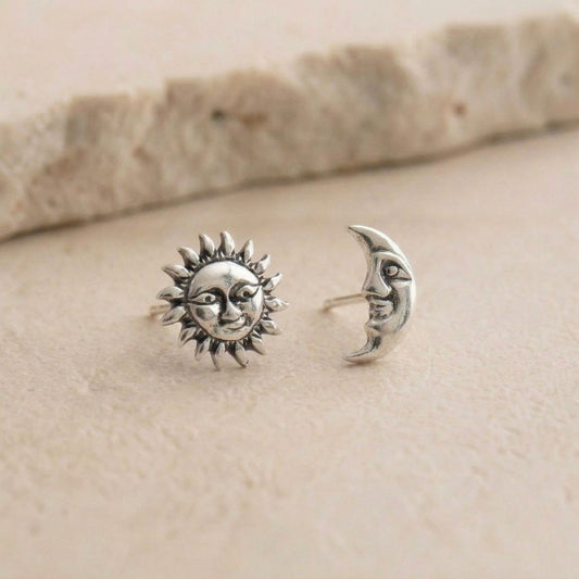 Sun and moon face stud earrings — sterling silver, mismatched pair